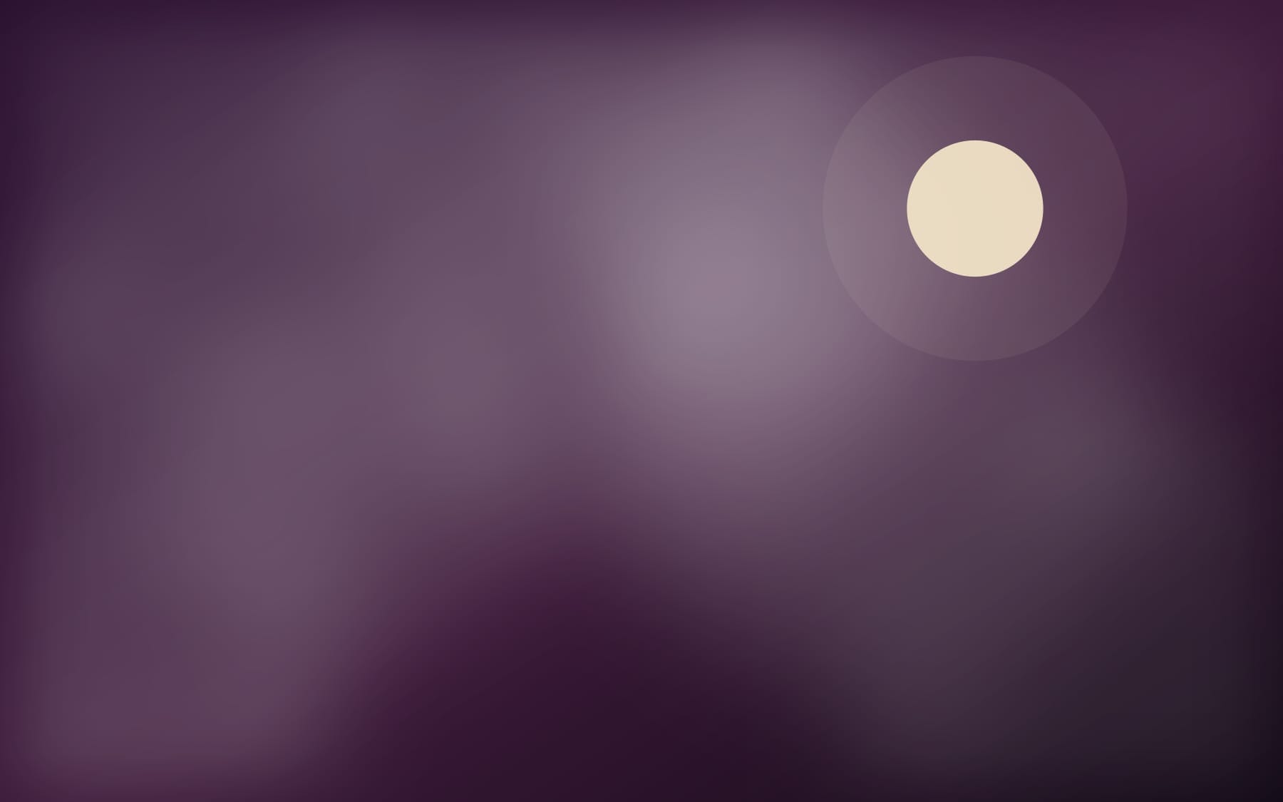 A low moon over a deep aubergine night sky
