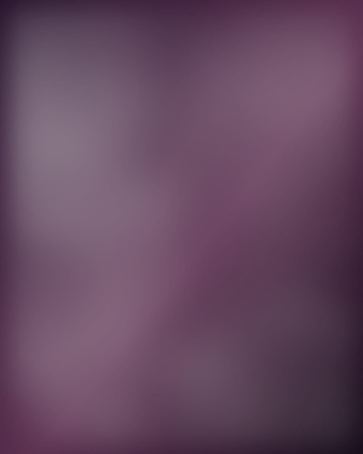A plum-coloured corner lit by a single lamp